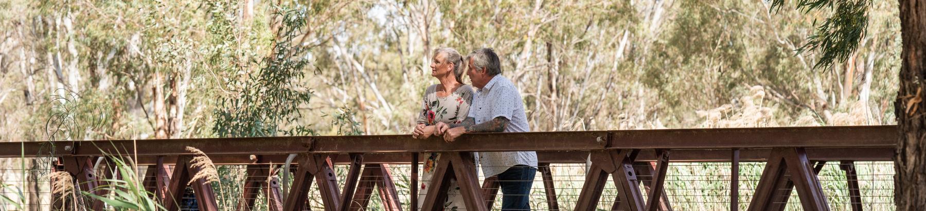 Man and Woman standing on Bridge at Narrandera Wetlands