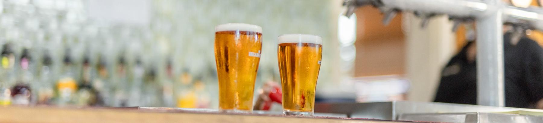 Two schooners of beer on bar in Charles Sturt Hotel