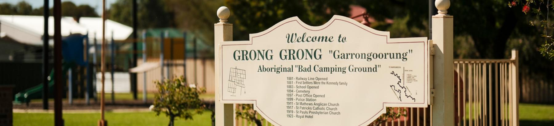 Grong Grong Park, with welcome sign in the foreground, and playground and BBQ area in the background 