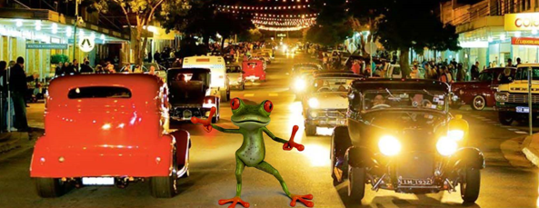  a frog dancing in between hot rods