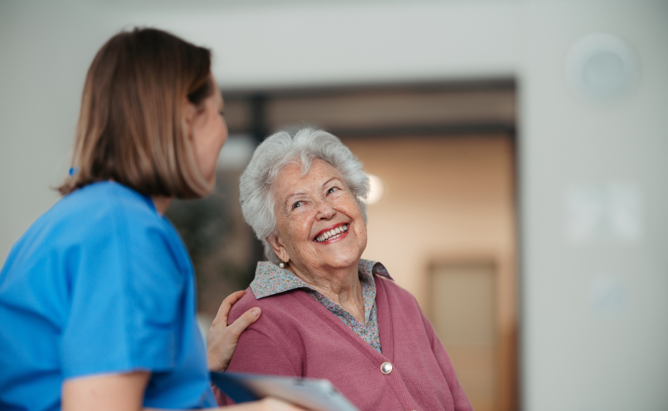 Healthcare workers talking to a woman