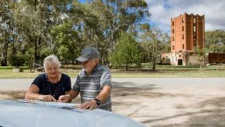 Couple looking at map at Brewery Flats, Narrandera NSW
