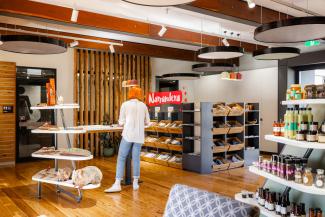 Inside the Destination and Discovery Hub, featuring locally grown produce, souvenirs, local artworks, and educational displays. 