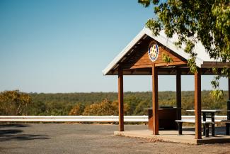Newly renovated wooden shelter at Lake Talbot Lookout with level access to seating and barbecue facilities.